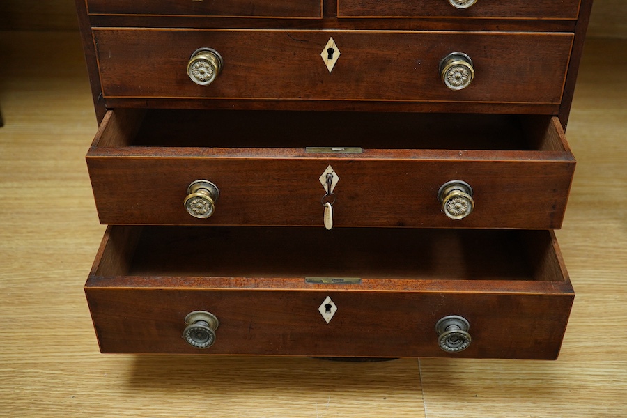 An early 20th century mahogany miniature chest of drawers, 39cm tall. Condition - one piece detached